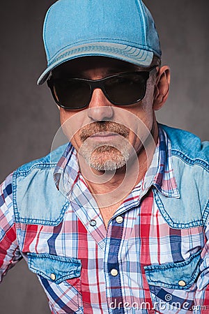 Senior casual man wearing baseball hat and sunglasses Stock Photo