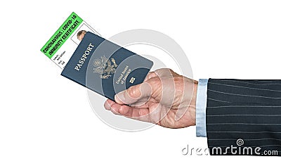 Senior caucasian hand holding US passport with virus immunity certificate Stock Photo