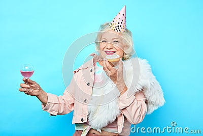 Senior charming woman having fun on her Birthday Stock Photo