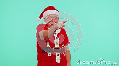 Senior Christmas grandfather man smiling excitedly, pointing to camera, beauty choosing lucky winner Stock Photo