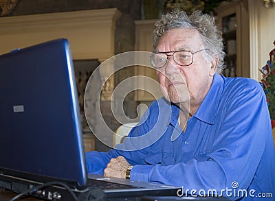 Senior citizen on computer Stock Photo