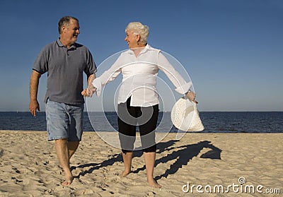 Senior couple on beach Stock Photo