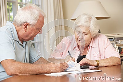 Senior Couple Concerned About Debt Going Through Bills Together Stock Photo