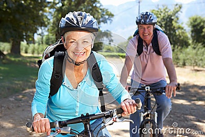 Senior couple on country bike ride Stock Photo