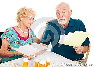 Senior Couple Distressed by Medical Bills Stock Photo