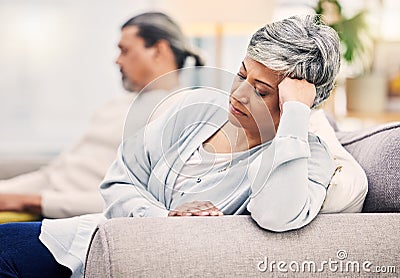 Senior couple, divorce and argument on sofa in conflict, fight or disagreement in living room at home. Elderly man and Stock Photo