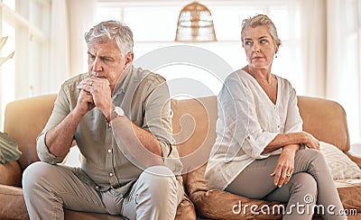 Senior couple, divorce and disagreement in conflict, fight or argument on living room sofa at home. Elderly woman and Stock Photo