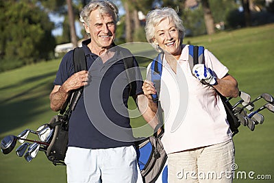 Senior Couple Enjoying Game Of Golf Stock Photo