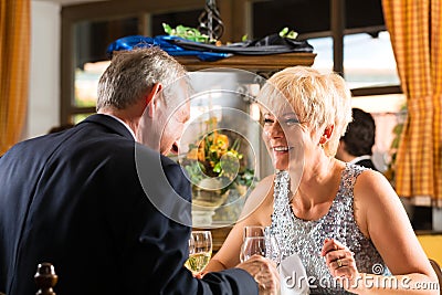 Senior couple fine dining in restaurant Stock Photo