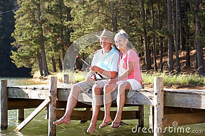 Senior couple having fun fishing Stock Photo