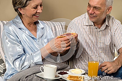 Senior couple having romantic morning breakfast Stock Photo