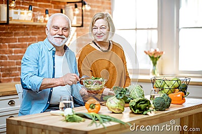 Senior couple with healthy food at home Stock Photo