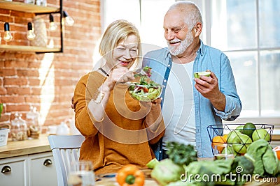 Senior couple with healthy food at home Stock Photo