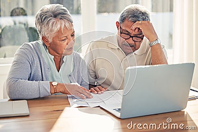 Senior couple, laptop and documents in financial crisis, schedule payment or checking bills at home. Mature man and Stock Photo