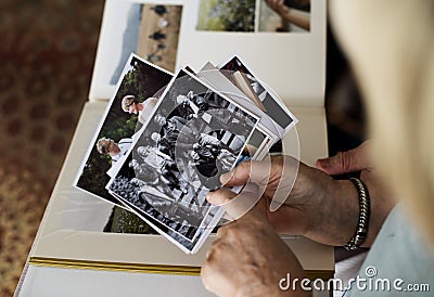 Senior couple looking at family photo album Stock Photo