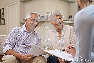 Senior couple meeting financial advisor Stock Photo