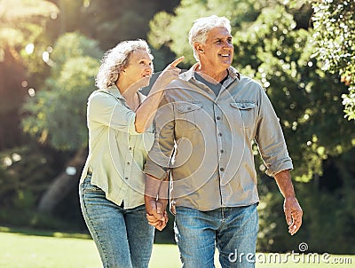 Senior couple, outdoor and conversation in nature park and active on hiking adventure or walk for love, relax and fresh Stock Photo
