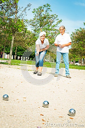 Senior Couple Playing Boule Stock Photo