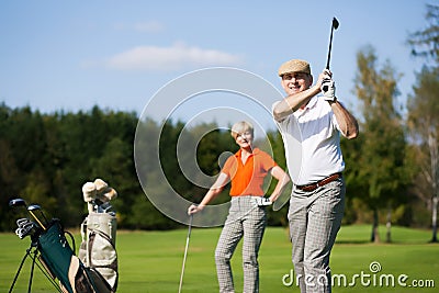 Senior couple playing Golf Stock Photo