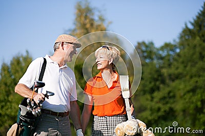 Senior couple playing Golf Stock Photo