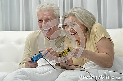 Senior couple playing video game Stock Photo