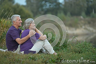 Senior couple resting outdoors Stock Photo