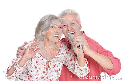 Senior couple singing karaoke Stock Photo