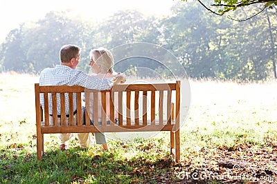 Senior couple sitting outdoors Stock Photo