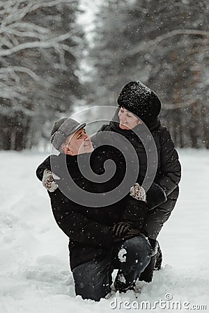 Beautiful senior couple in winter nature Stock Photo