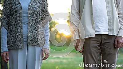 Senior couple standing apart, medical insurance of elderly people, opinion poll Stock Photo