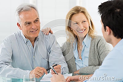 Senior Couple Talking With A Consultant Stock Photo