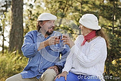 Senior couple toast each other Stock Photo