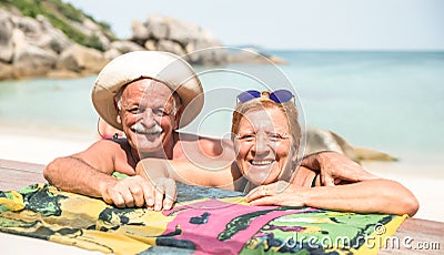 Senior couple vacationer having genuine fun on Koh Samui tropical beach in Thailand - Excursion tour in exotic scenario Stock Photo