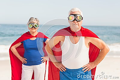 Senior couple wearing superman costume Stock Photo