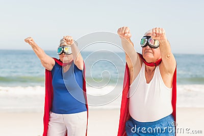 Senior couple wearing superman costume Stock Photo