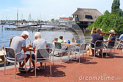 Senior couples families lake cafe terrace, Loosdrecht, Netherlands Editorial Stock Photo