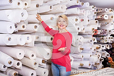 Customer boasting purchased home textiles Stock Photo