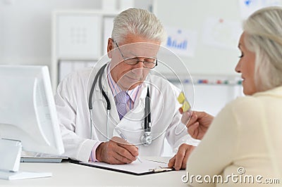 Portrait of senior doctor with a elderly patient Stock Photo