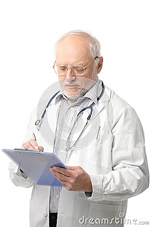 Senior doctor looking at clipboard Stock Photo