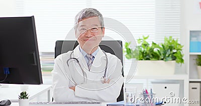 Senior doctor smile to you Stock Photo