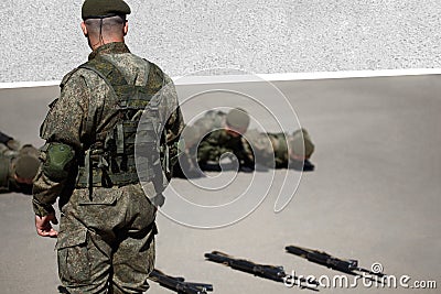 Senior drill instructor. The sergeant does pushups with his platoon during basic combat training Editorial Stock Photo