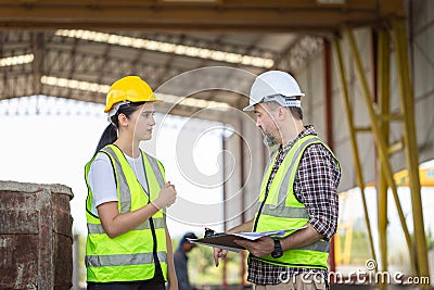 Senior engineer and female foreman team checking project at precast concrete factory site, Caucasian engineer and worker in Stock Photo