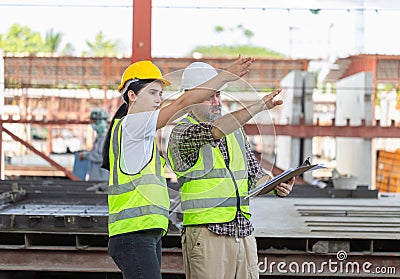 Senior engineer and female foreman team checking project at precast concrete factory site, Caucasian engineer and worker in Stock Photo