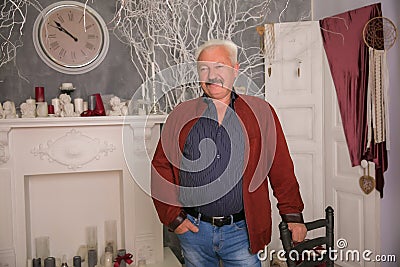 Senior expertise gray hair businessman posing interior modern Stock Photo