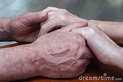 Senior family couple holding old hands, psychological support concept Stock Photo