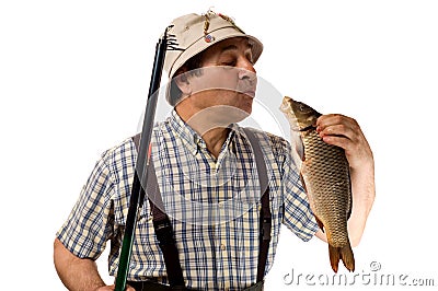 Senior fisherman with fishing rod and his catch Stock Photo