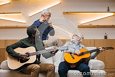 Senior friends playing music Stock Photo