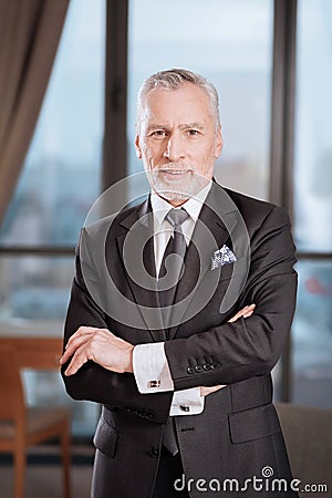 Senior glad man staying calm Stock Photo