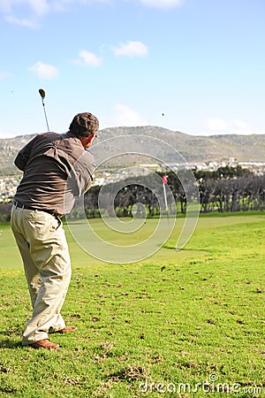 Senior golfer in action Stock Photo