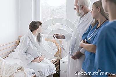 Senior doctor and female young intern working together at hospital Stock Photo